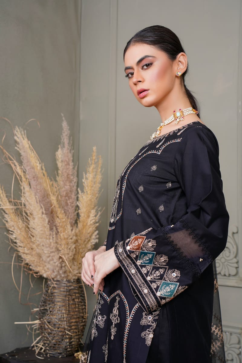 Elegant embroidered velvet suit with luxurious texture and rich color
