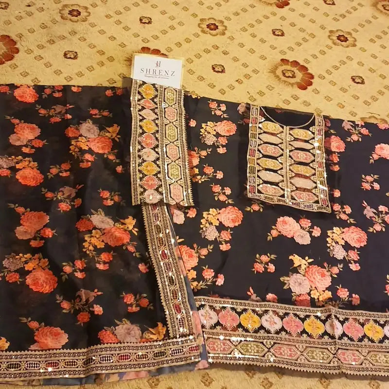 Aneela’s Collection Shamooz Silk 3PC embroidered suit with digital printed shirt, embroidered borders, and silk dupatta with 4-side cut work border.
