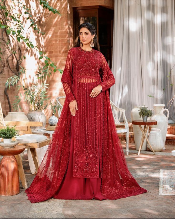 Akber Aslam embroidered net suit with Malai trouser, heavy sequence embroidery, handwork neckline, embroidered dupatta & borders.
