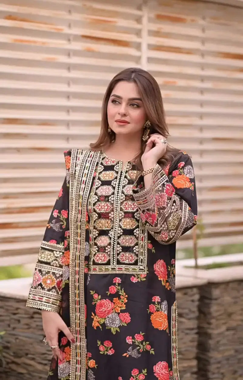 Aneela’s Collection Shamooz Silk 3PC embroidered suit with digital printed shirt, embroidered borders, and silk dupatta with 4-side cut work border.
