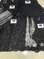 Maria B Black Net Saree with heavy embroidery, adda work, cutwork borders, tassel pallu, and silk petticoat – 2025 Exclusive.