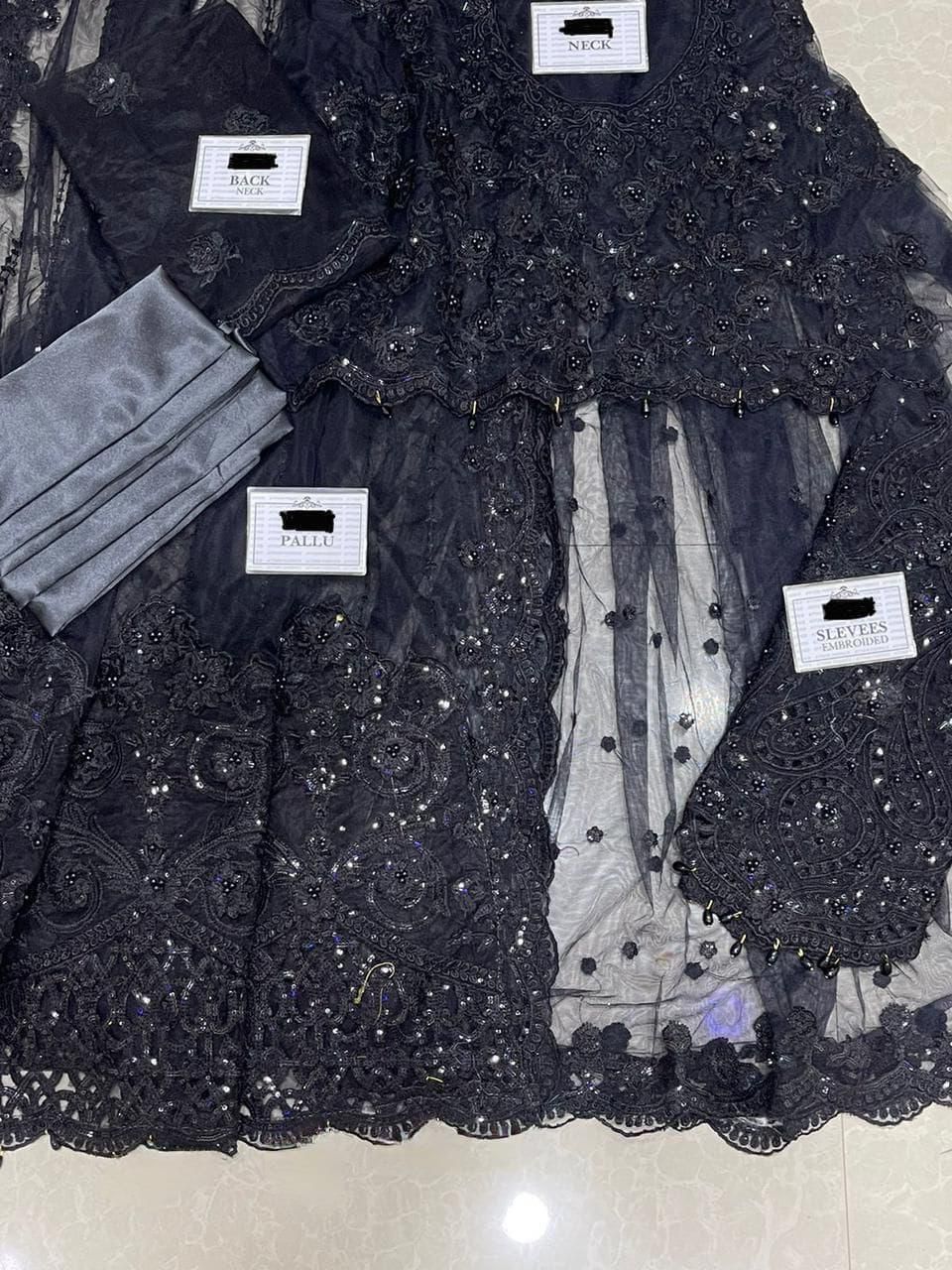 Maria B Black Net Saree with heavy embroidery, adda work, cutwork borders, tassel pallu, and silk petticoat – 2025 Exclusive.