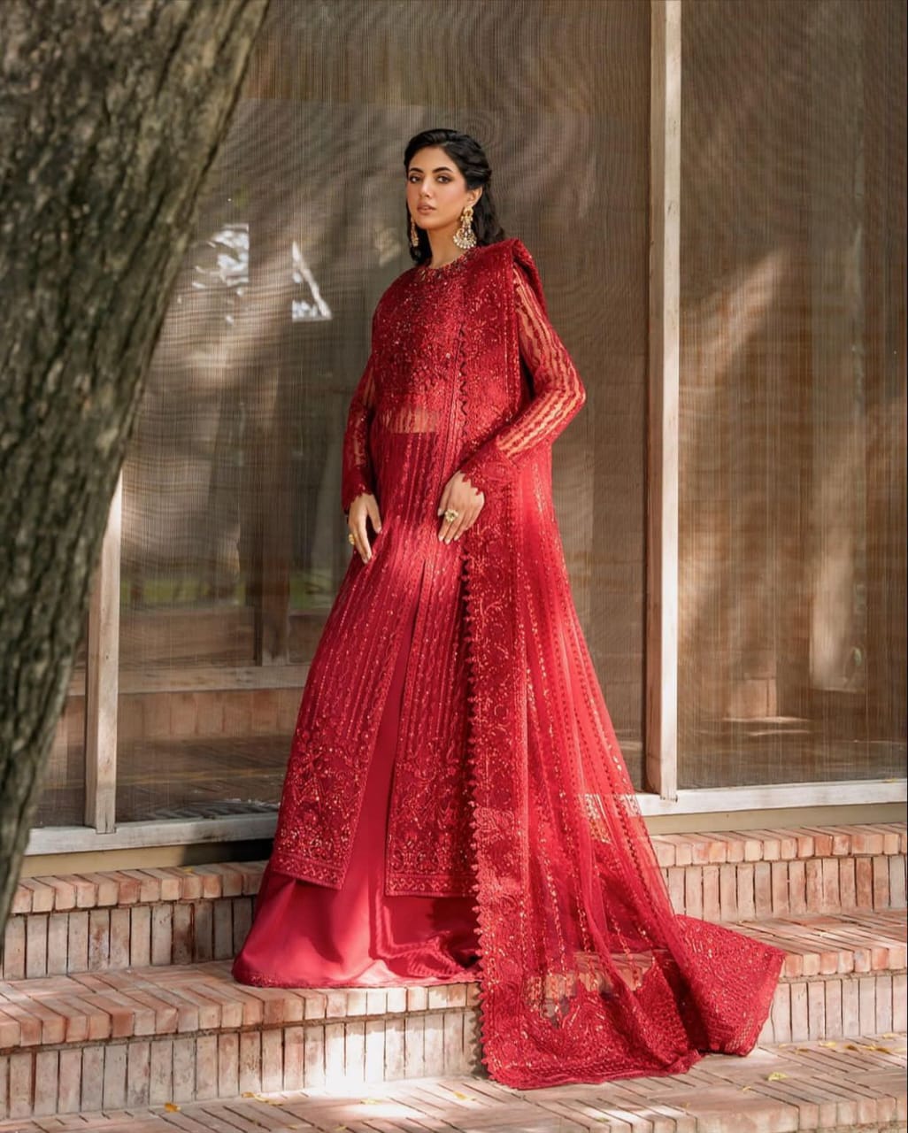 Akber Aslam embroidered net suit with Malai trouser, heavy sequence embroidery, handwork neckline, embroidered dupatta & borders.
