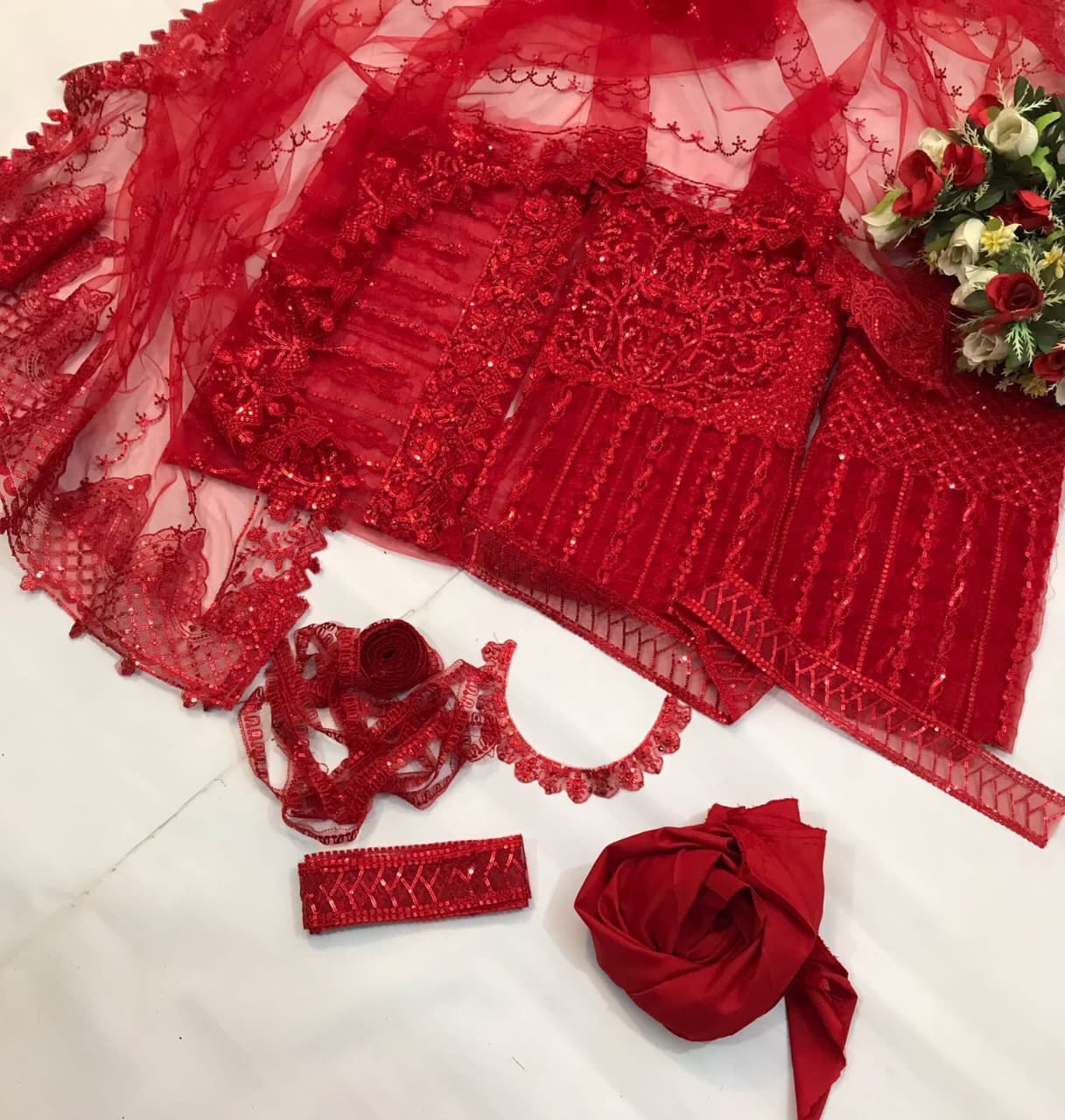 Akber Aslam embroidered net suit with Malai trouser, heavy sequence embroidery, handwork neckline, embroidered dupatta & borders.
