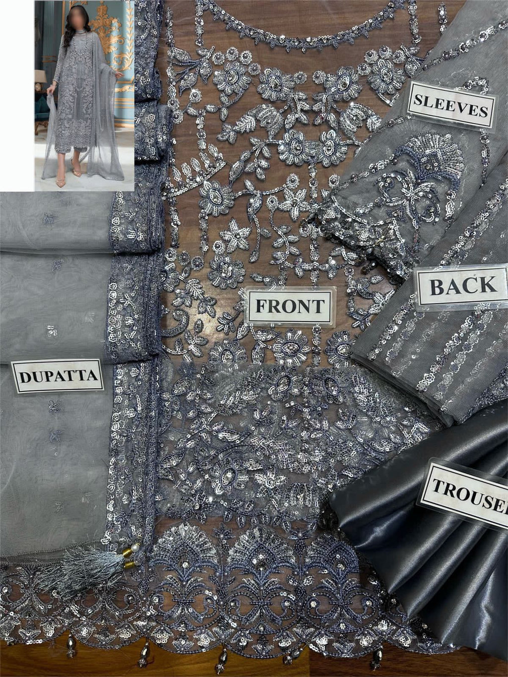 LAAM embroidered net suit with satin silk, sequence work, fancy tussles, embroidered dupatta & plain trouser.
