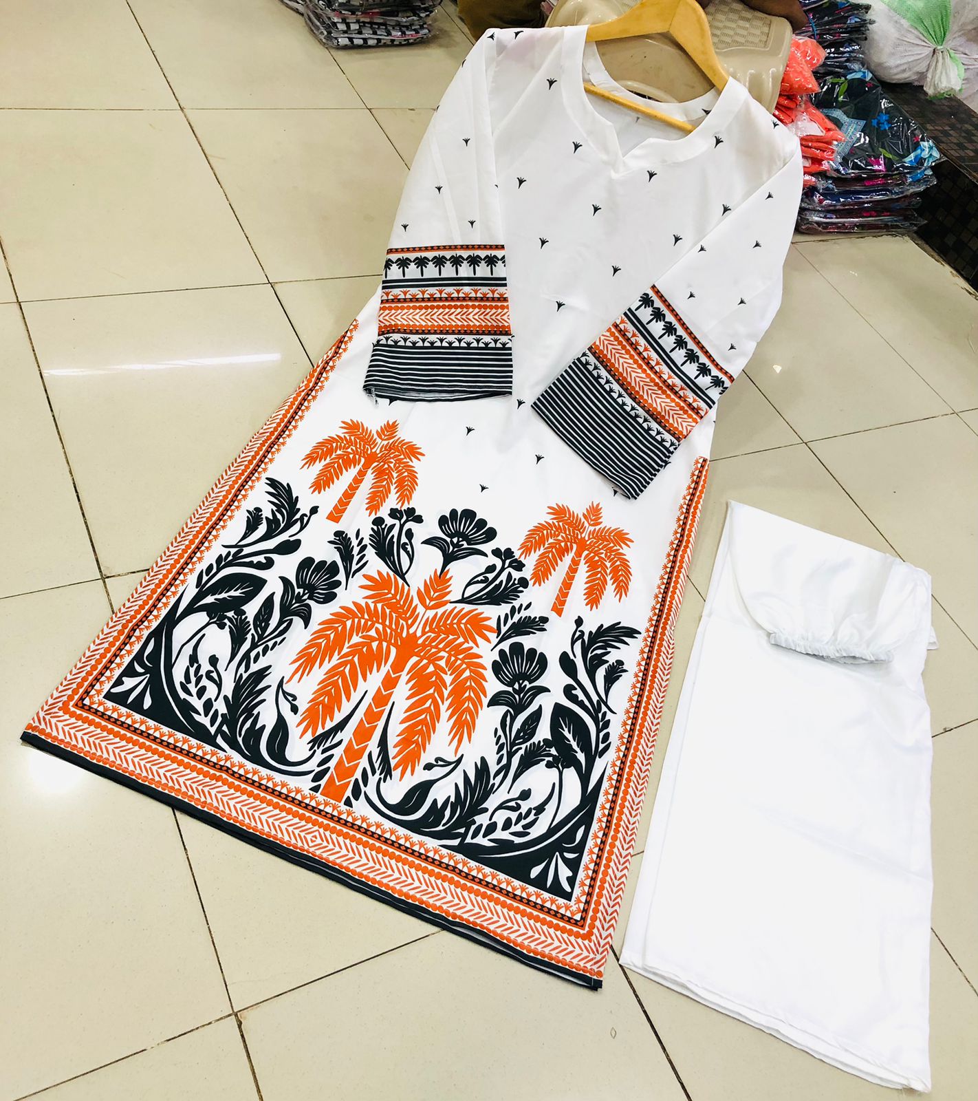 Co-Ord Set 2-Piece Suit in Swiss Lawn featuring digital printed long shirt and bell bottom trouser – trendy and stylish design