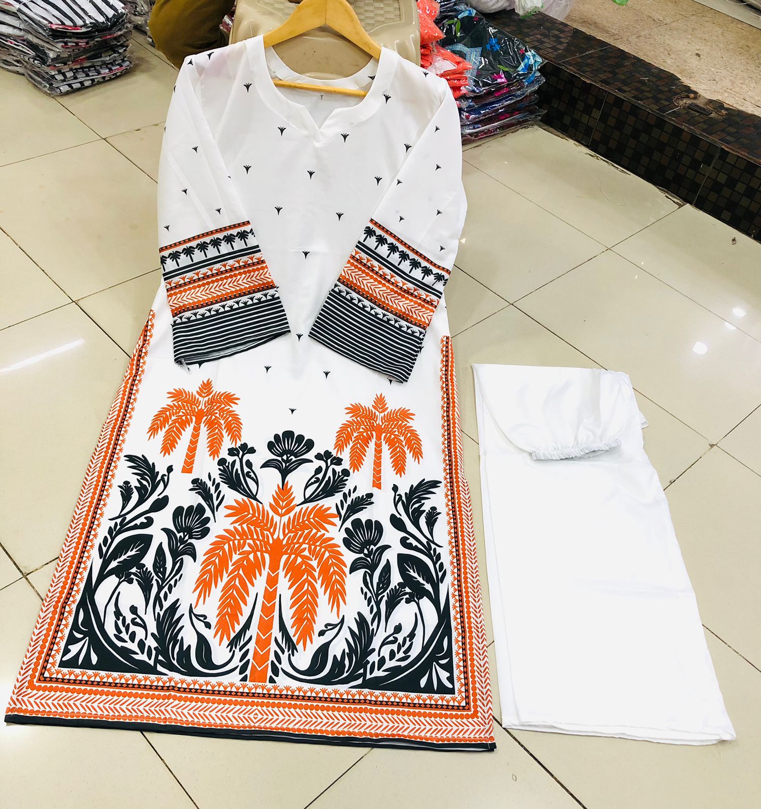 Co-Ord Set 2-Piece Suit in Swiss Lawn featuring digital printed long shirt and bell bottom trouser – trendy and stylish design